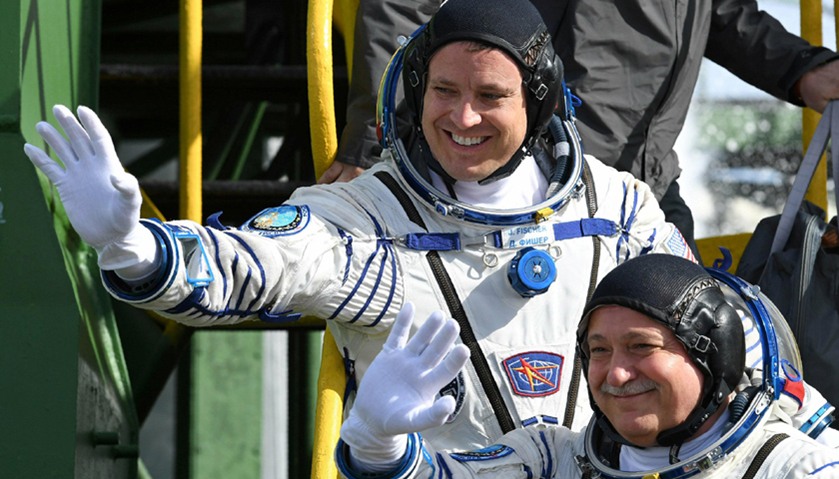 Crew members Jack Fischer of the U.S. (top) and Fyodor Yurchikhin of Russia board the Soyuz MS-04 sp