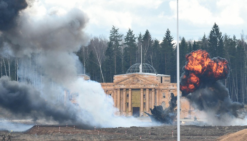 Participants storm a replica of the Reichstag during a historical military reenactment