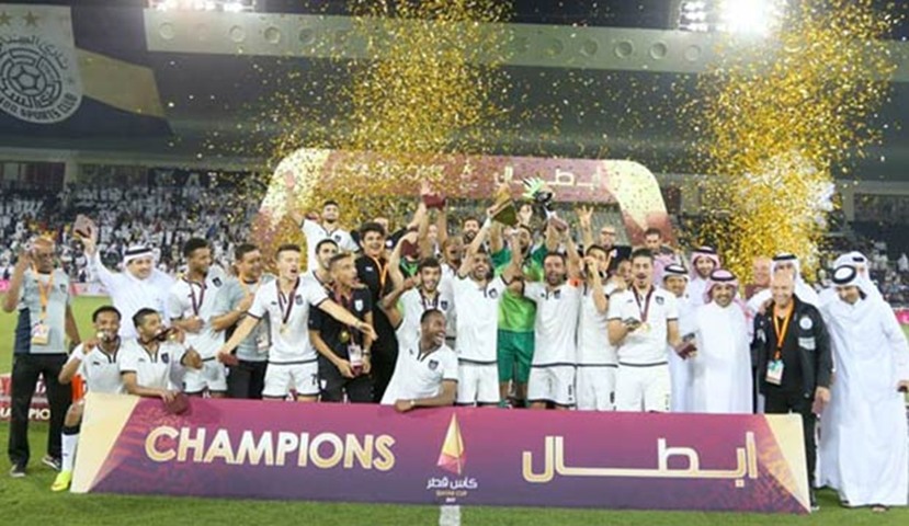 Al Sadd players celebrate after winning the Qatar Cup on Saturday