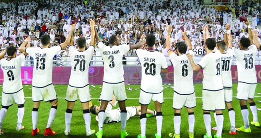 Al Sadd players acknowledge their fans after the victory