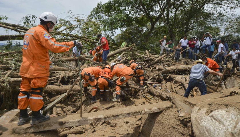 Rescuers search for victims following mudslides caused by heavy rains in Mocoa