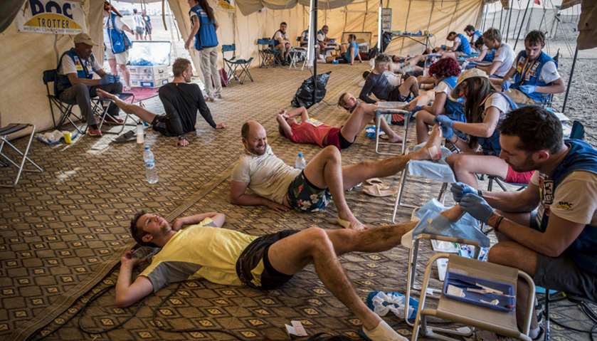 Competitors get treated after taking part in the Stage 2 of the 33rd edition of the Marathon des Sab