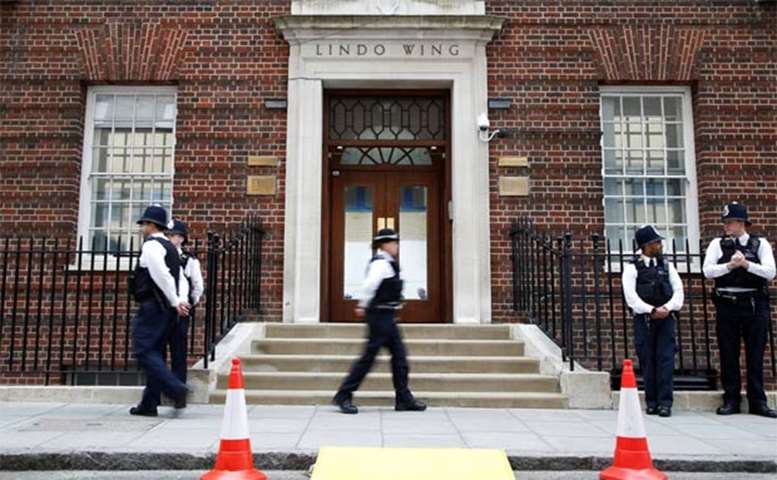 Police officers stand outside the Lindo Wing of St Mary\'s Hospital in London on Monday