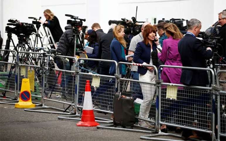 Journalists stand outside St Mary\'s Hospital in London in anticipation of the new royal arrival