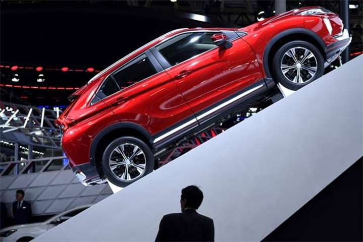 A Mitsubishi Eclipse Cross is on show at the Beijing event