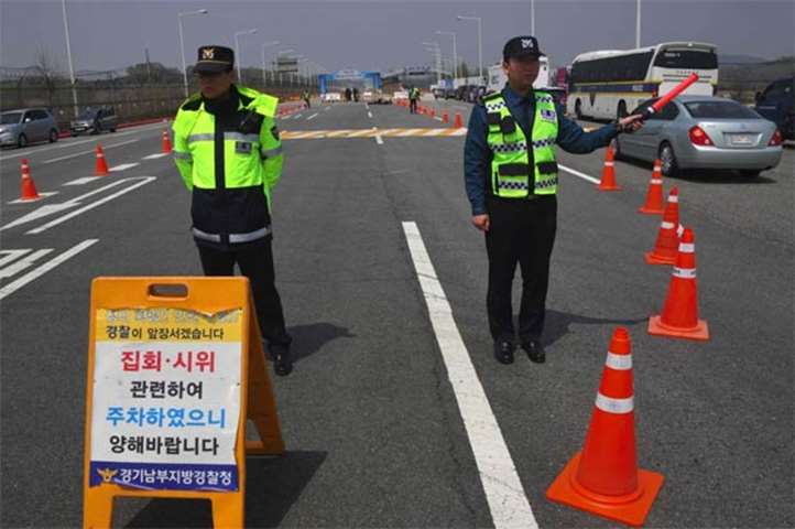 South Korean policemen stand near a checkpoint leading to the border truce village of Panmunjom