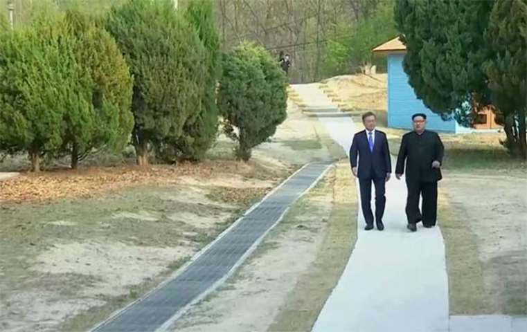 Moon Jae-in and Kim Jong Un talk during the inter-Korean summit on Friday