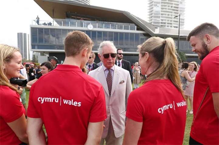 Prince Charles chats with Welsh athletes on Broadbeach in Gold Coast on Thursday