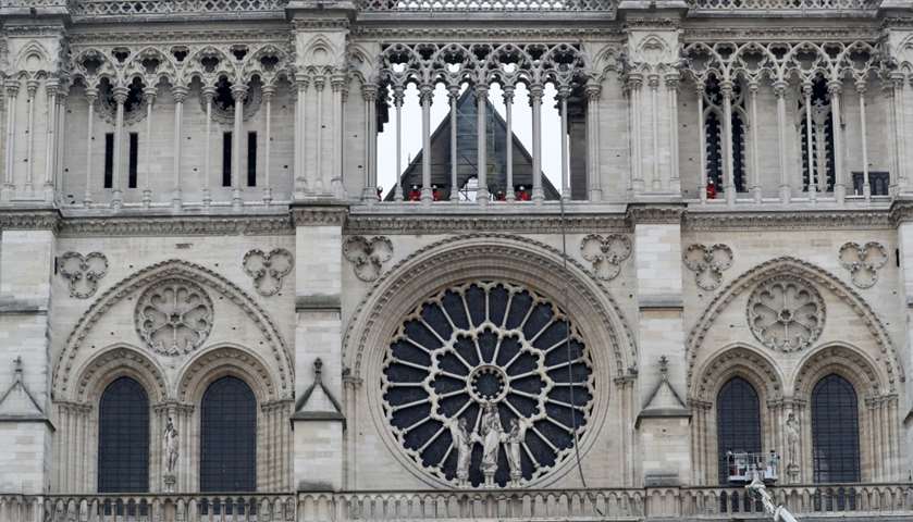 Firefighters work at Notre-Dame Cathedral 

