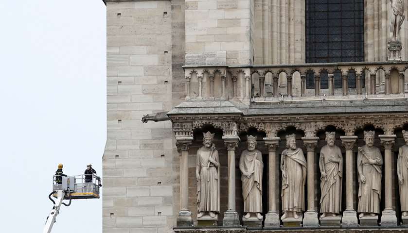 Firefighters work at Notre-Dame Cathedral