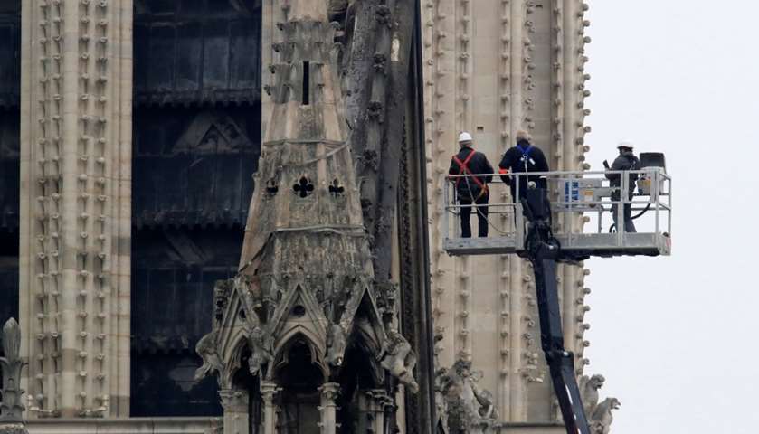 Officials work at Notre-Dame Cathedral
