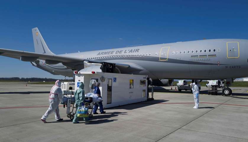 Medical staff embark a patient onboard medicalised Airbus A330 Phenix aircraft