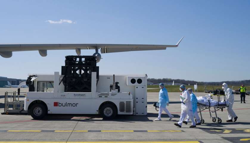 Medical staff embark a patient onboard medicalised Airbus A330 Phenix aircraft 
