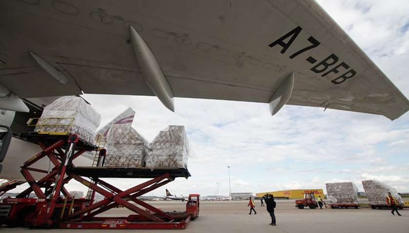 Qatar airways plane unloading sanitary and protection material in Madrid