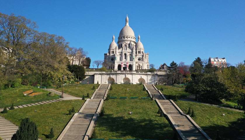 An aerial view shows the deserted Butte Montmartre and the Sacre-Coeur Basilica in Paris