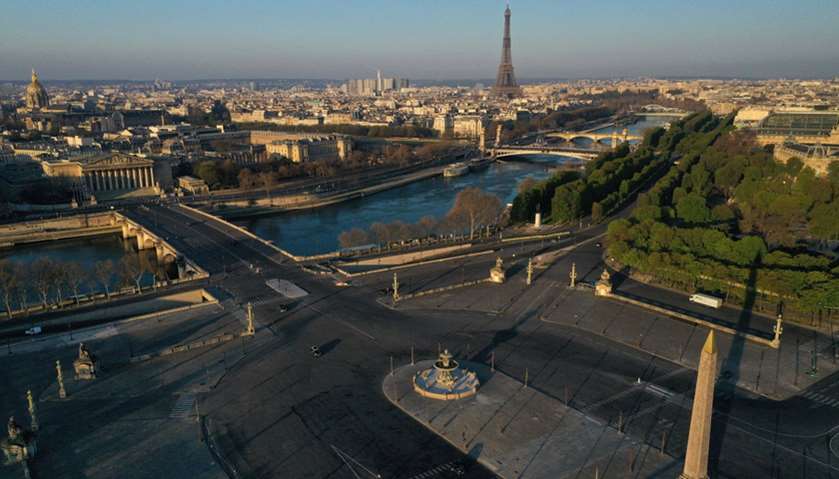 An aerial view shows the deserted Place de la Concorde with the Eiffel tower in the background