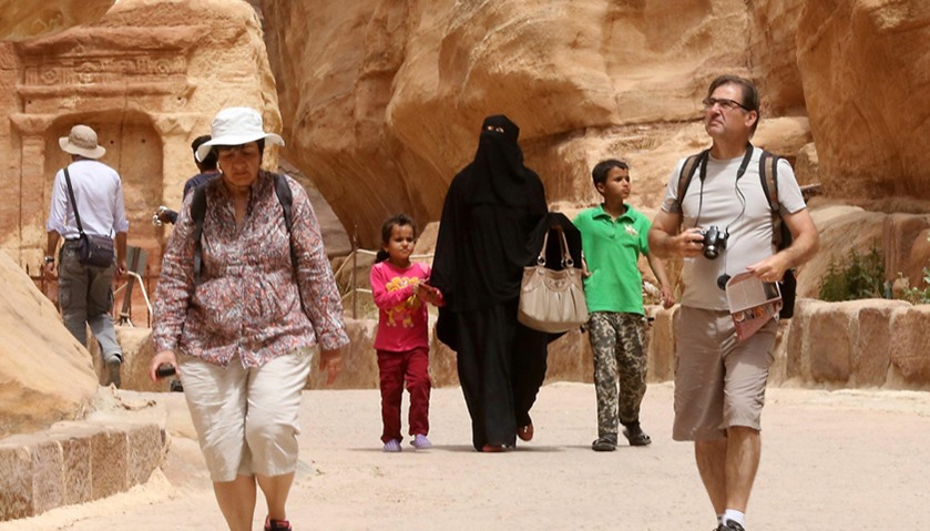 Tourists visit the ancient city of Petra in Jordan