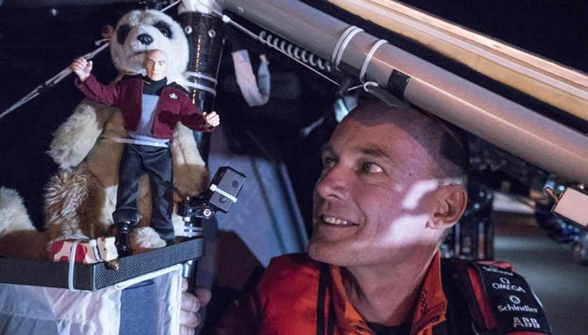 Swiss adventurer Bertrand Piccard looks at a figurine of Captain Jean-Luc Picard