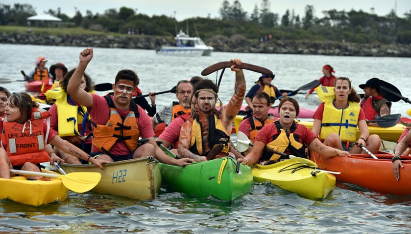 A group of protesters shout as they block shipping access to Australia\'s largest coal port in Newcas