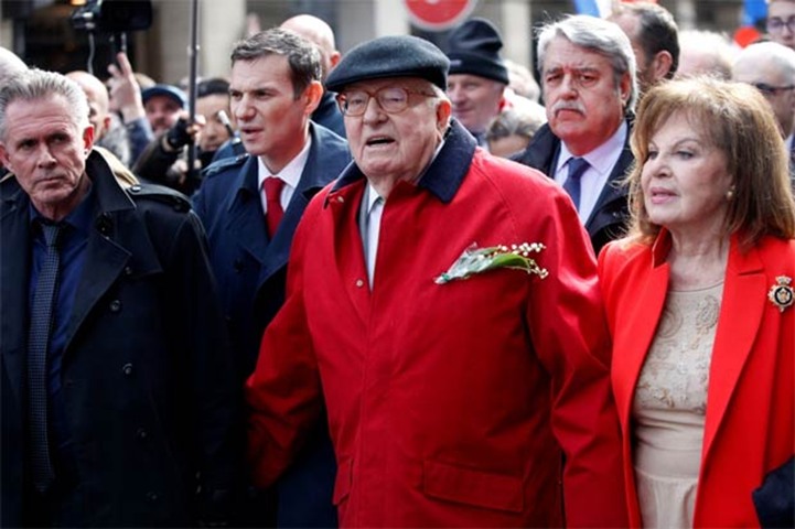 French National Front founder Jean-Marie Le Pen and his wife Jany attend a demonstration in Paris