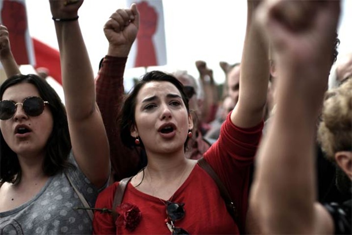Members of the Greek communist labour union demonstrate in central Athens on Monday