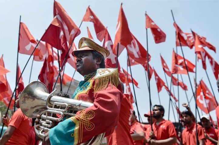 Indian workers and members of trade unions take part in a May Day rally in Bengaluru