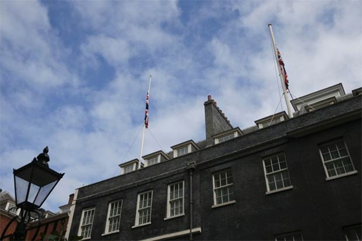 Flags fly at half-mast above Downing Street in London following the deadly attack