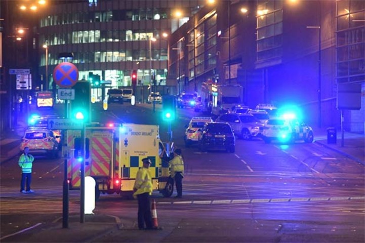 Emergency response vehicles are parked at the scene of the attack in Manchester