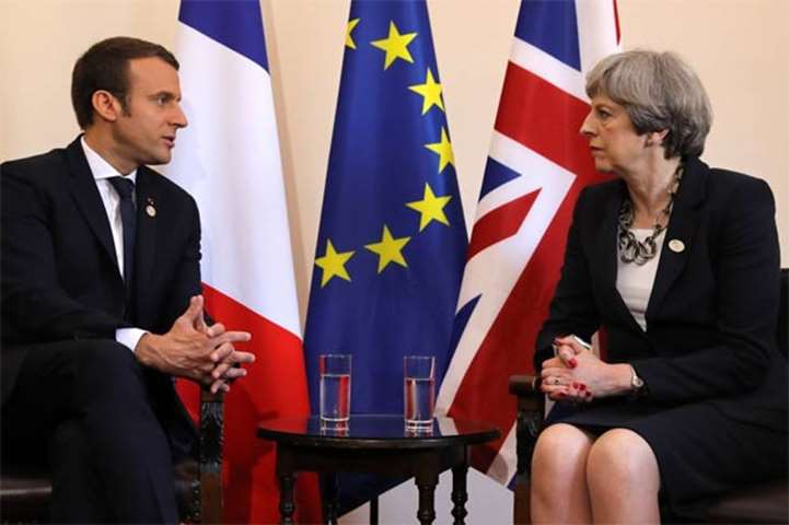 Britain\'s Prime Minister Theresa May and French President Emmanuel Macron meet in Sicily