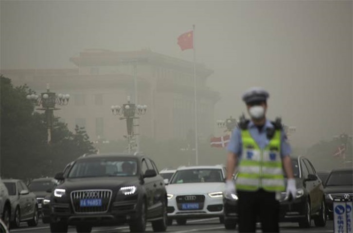 The Great Hall of the People is seen after a dust storm hit Beijing