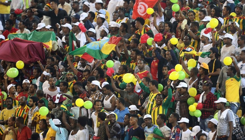 Supporters cheer during a competition