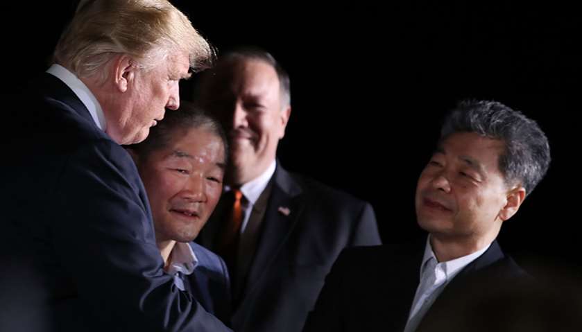 US President Donald Trump stands with Americans just released from North Korea, Kim Dong Chul, Kim H