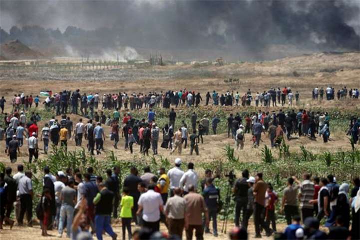 Palestinian demonstrators gather at the Israel-Gaza border on Monday