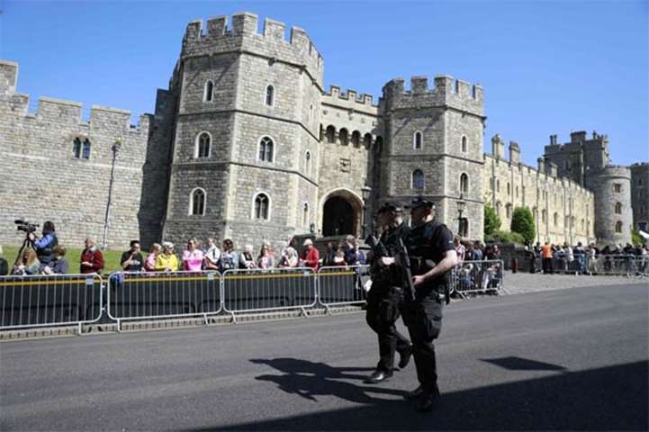 Police patrol outside the Henry VIII Gate at Windsor Castle