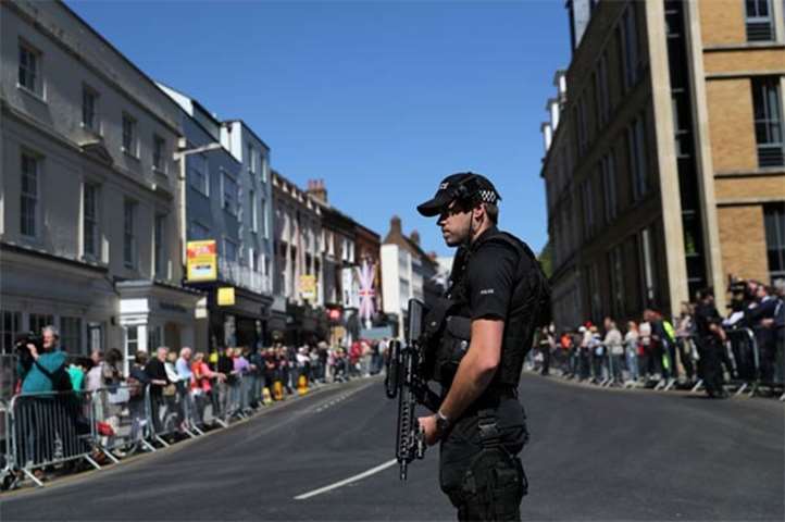 Armed police officers patrol the streets near Windsor Castle on Thursday