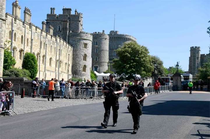 Police patrol outside Windsor Castle two days before the wedding of Prince Harry and Meghan Markle