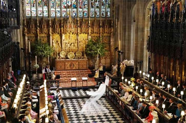 Prince Harry sits with Meghan Markle during the reading in St George\'s Chapel, Windsor Castle