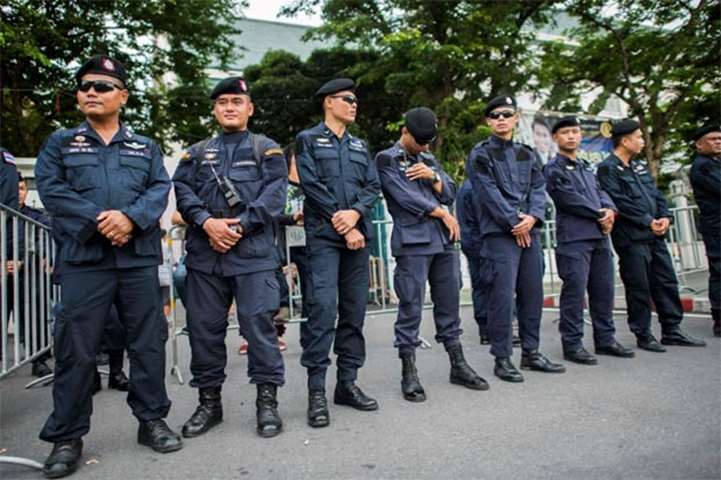 Royal Thai police secure an entrance to the Thammasat University on Tuesday