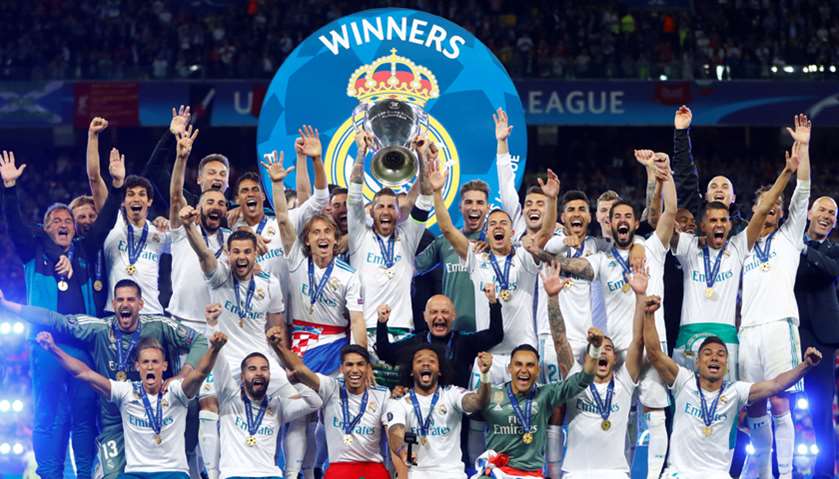Real Madrid celebrate winning the Champions League with the trophy
