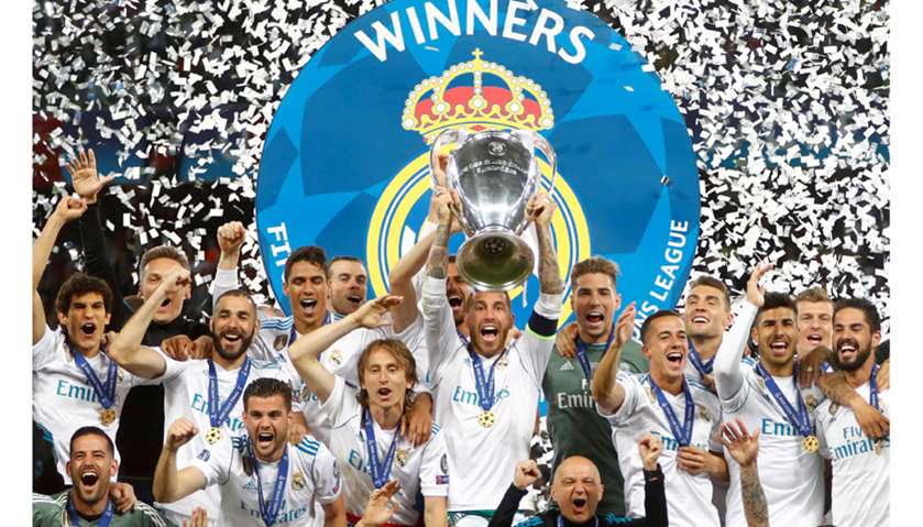 Real Madrid\'s Sergio Ramos lifts the trophy as they celebrate winning the Champions League
