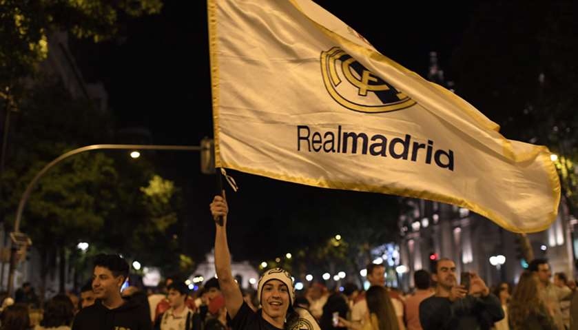 Real Madrid fans celebrate o the Plaza Cibeles in downtown Madrid