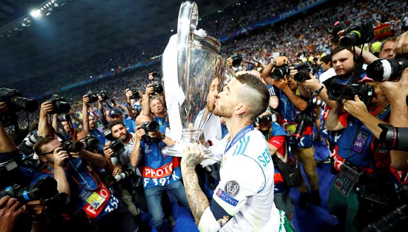 Real Madrid\'s Sergio Ramos kisses the trophy as he celebrates winning the Champions League