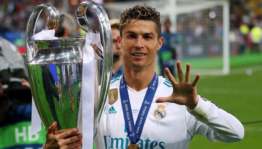 Real Madrid\'s Cristiano Ronaldo gestures as he celebrates winning the Champions League with the trop