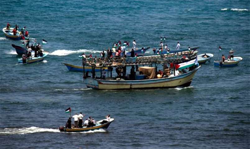 Fishing boats carrying a group of Palestinian activists setting to sail from Gaza City harbour