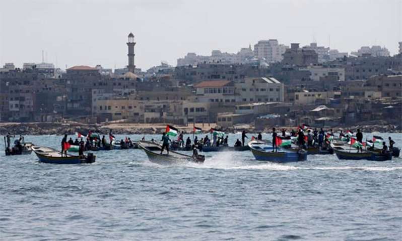 People ride boats as Palestinians prepare to break Israel\'s maritime blockade on Gaza