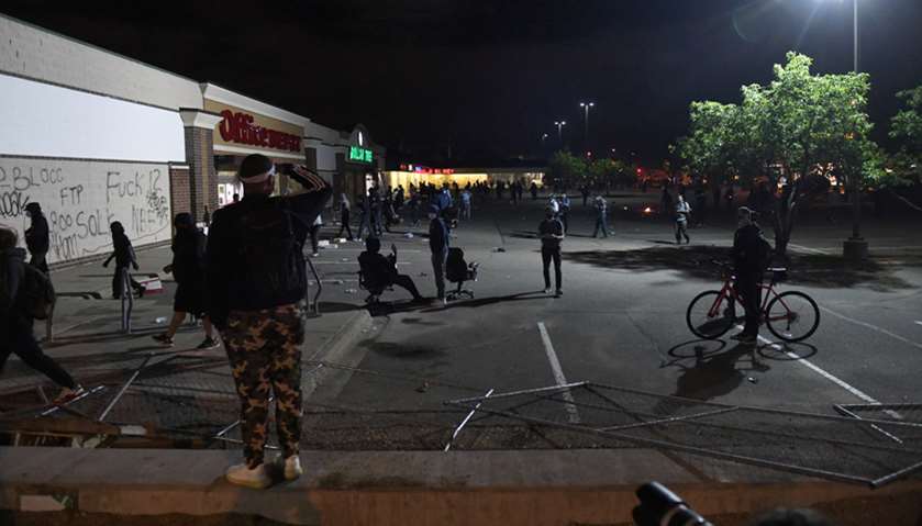 Looters vandalize Office Depot and a Dollar Tree store, setting fires and taking merchandise near th
