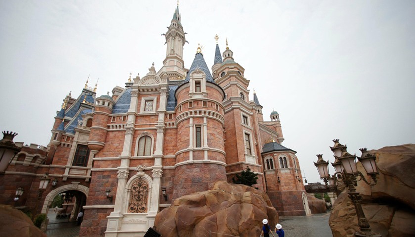 Staff walk at Shanghai Disney Resort during a three-day Grand Opening event in Shanghai, China