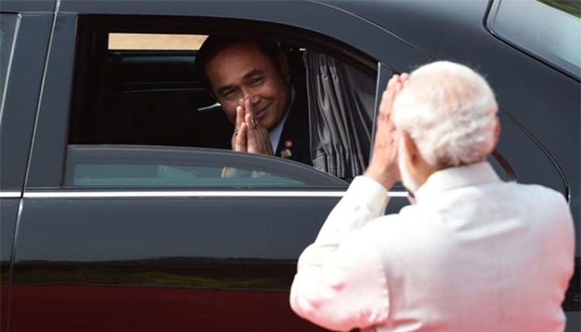 Prayut Chan-O-Cha gestures to Narendra Modi as he leaves after a ceremonial reception in New Delhi