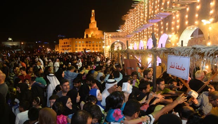 People take part in celebrations marking Garangao at Souq Waqif on Sunday
