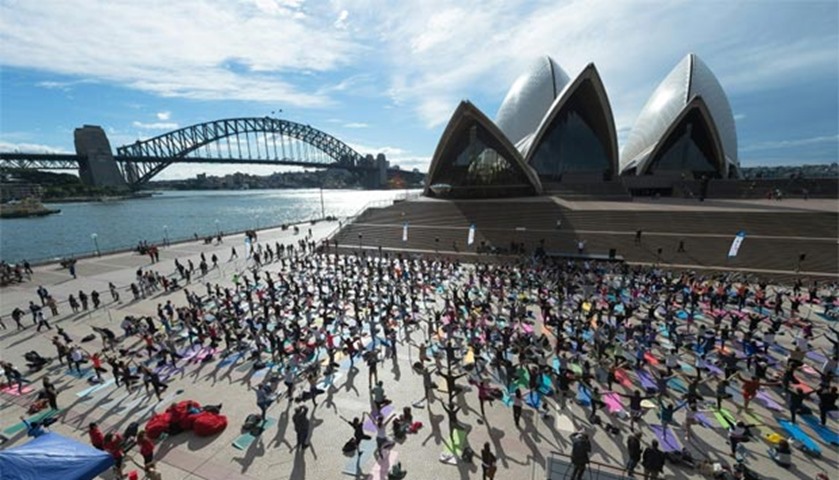 Sydneysiders enagage in a yoga event in front of Australia\'s iconic Opera House in Sydney